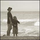 man and girl are kiting, ocean photograph, nostalgic photograph, san francisco ocean beach photograph